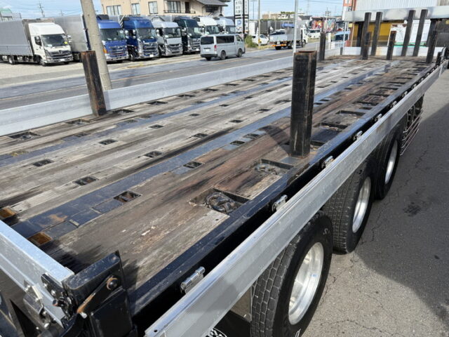 トレクス：平床セミトレーラー：アオリ20㎝：5方開：3軸：板バネ：最大積載量28.500㎏