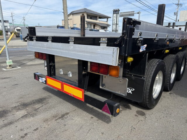 トレクス：平床セミトレーラー：アオリ20㎝：5方開：3軸：板バネ：最大積載量28.500㎏