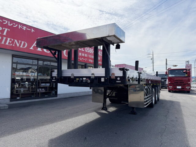 トレクス：平床セミトレーラー：アオリ20㎝：5方開：3軸：板バネ：最大積載量28.500㎏