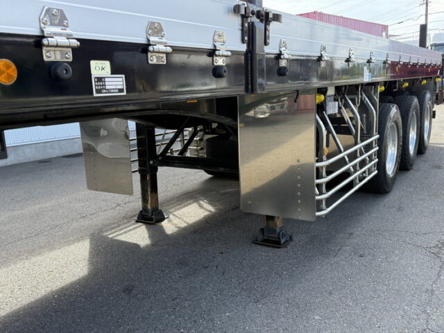 トレクス：平床セミトレーラー：アオリ20㎝：5方開：3軸：板バネ：最大積載量28.500㎏