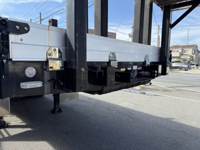 トレクス：平床セミトレーラー：アオリ20㎝：5方開：3軸：板バネ：最大積載量28.500㎏